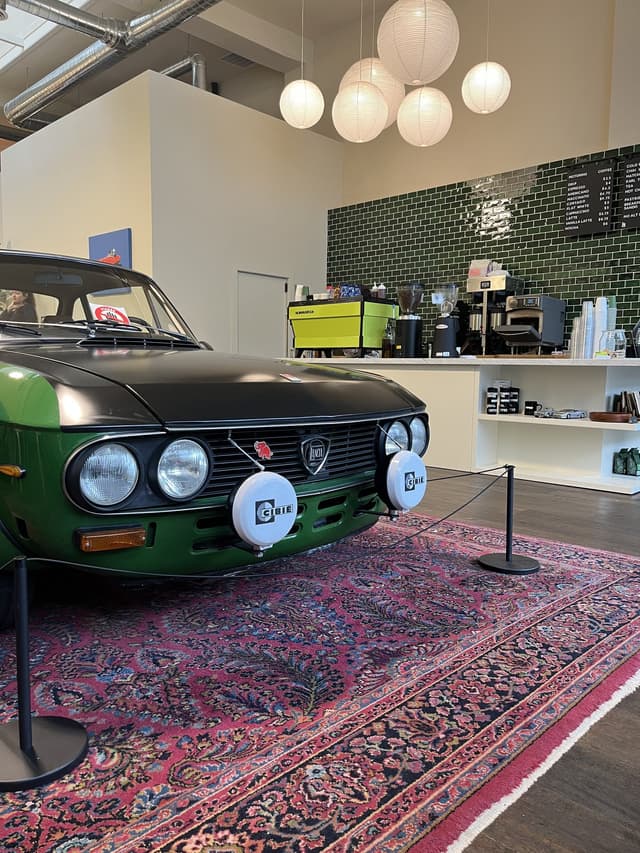 Motoring Coffee in San Francisco — the Fulvia's Cibié lamps in front of the espresso bar